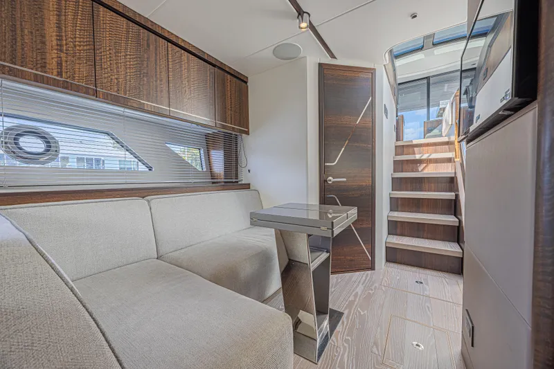 Slide: The Image of Luxurious interior of 2021 Sunseeker Predator 60 EVO yacht with modern seating and wooden accents. - 42