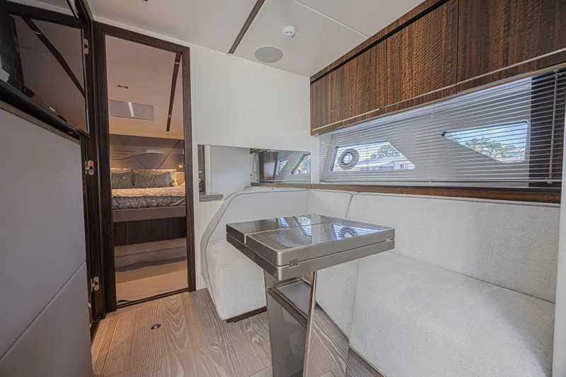 Slide: The Image of Luxurious interior of 2021 Sunseeker Predator 60 EVO yacht with modern seating and bedroom view. - 43