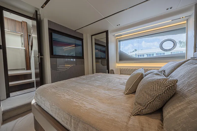 Slide: The Image of Luxurious bedroom interior of 2021 Sunseeker Predator 60 EVO yacht, featuring elegant design. - 47