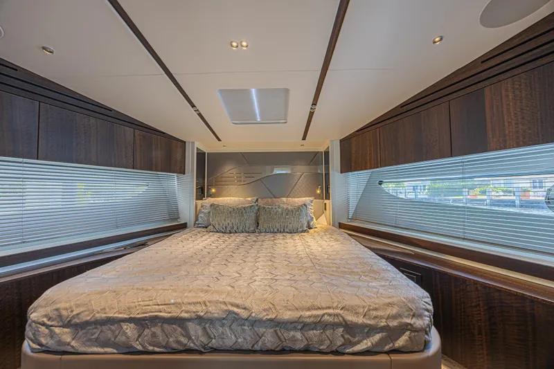 Slide: The Image of Luxurious bedroom interior of 2021 Sunseeker Predator 60 EVO yacht with elegant bedding. - 50