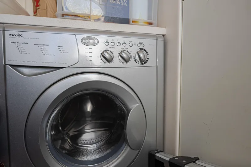 Slide: The Image of Splendide washing machine in a compact laundry space on a Sunseeker Predator 60 EVO yacht. - 53