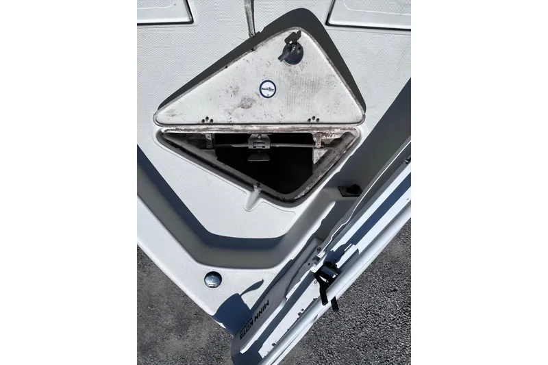 Slide: The Image of 2016 NauticStar 1810 NauticBay boat anchor compartment, open and empty. - 8