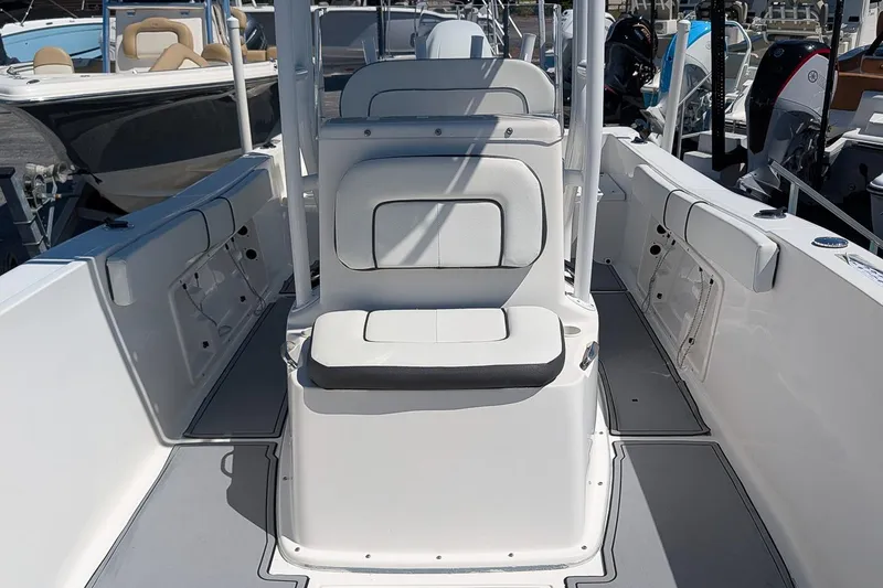 Slide: The Image of 2022 Clearwater 2000 Center Console boat interior with seating and storage compartments. - 12
