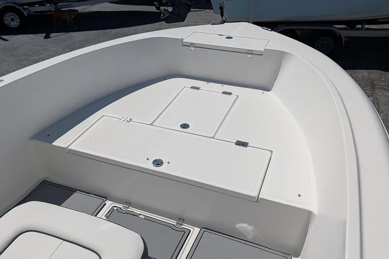 Slide: The Image of 2022 Clearwater 2000 Center Console boat interior with storage compartments. - 13