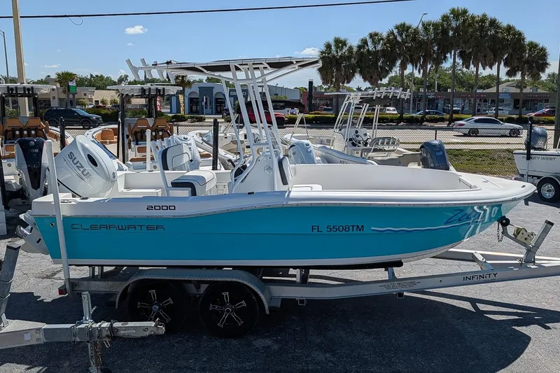 Slide: The Image of 2022 Clearwater 2000 Center Console boat on trailer, displayed outdoors. - 4