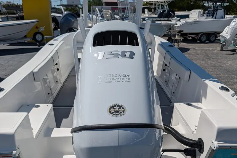 Slide: The Image of 2022 Clearwater 2000 Center Console boat with 150 horsepower engine, docked outdoors. - 6