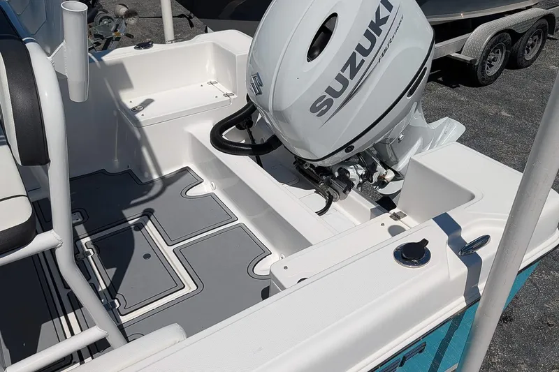 Slide: The Image of ```plaintext 2022 Clearwater 2000 Center Console boat with Suzuki outboard motor, interior view. ``` - 7