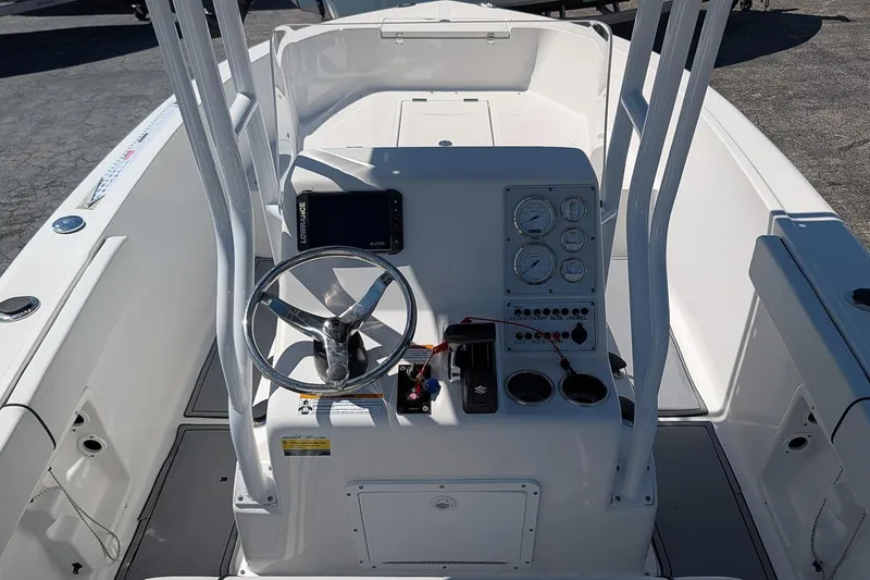 Slide: The Image of 2022 Clearwater 2000 Center Console boat interior with steering wheel and control panel. - 9