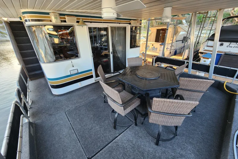 Slide: The Image of Houseboat deck with wicker chairs and table, Sharpe 85 model, year 2000. - 12