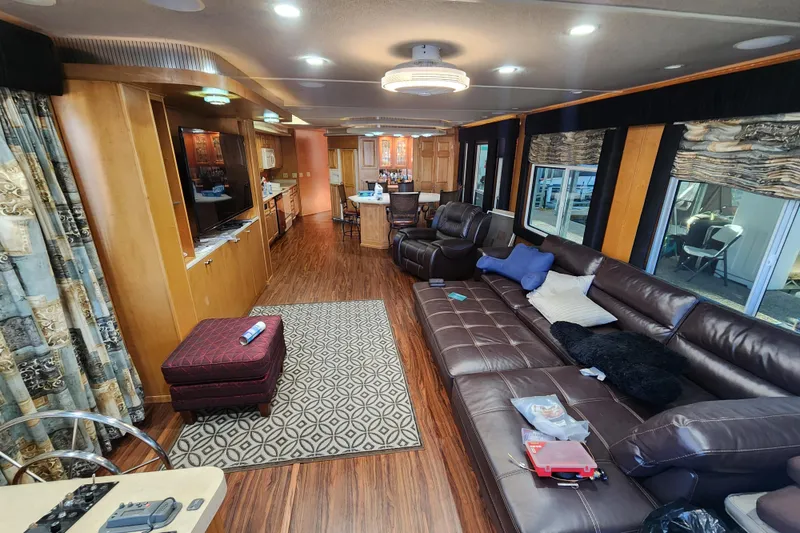 Slide: The Image of Luxurious houseboat interior with leather seating, modern decor, and wood flooring, Sharpe 85 model, 2000. - 13