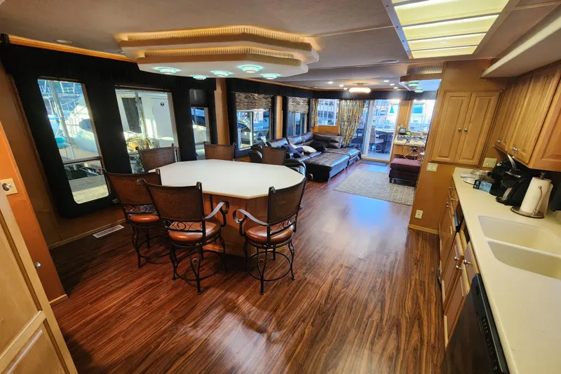 Slide: The Image of Luxurious interior of a 2000 Sharpe 85 houseboat with elegant dining and living areas. - 14