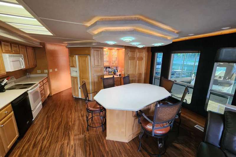 Slide: The Image of Luxurious kitchen interior of 2000 Sharpe 85 model houseboat with modern amenities. - 16