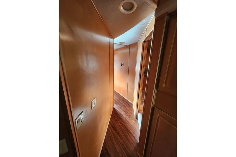 Slide: The Image of Narrow hallway with wooden paneling in a 2000 Sharpe 85 model. - 27