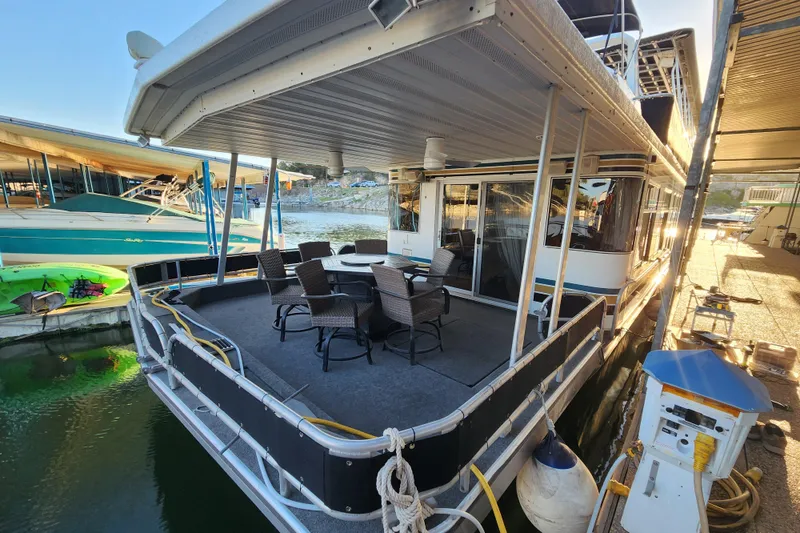 Slide: The Image of Houseboat with outdoor seating, docked at marina, Sharpe 85 model, year 2000. - 4