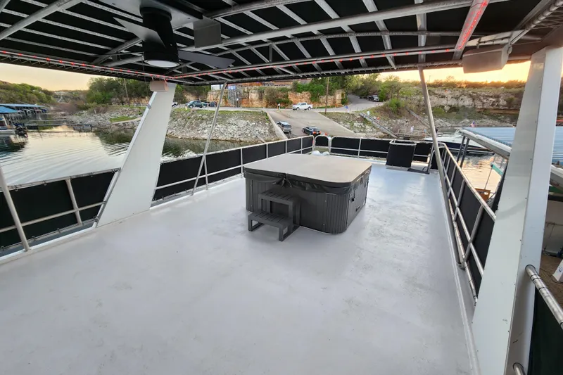 Slide: The Image of Spacious upper deck of 2000 Sharpe 85 houseboat with hot tub and scenic lake view. - 42