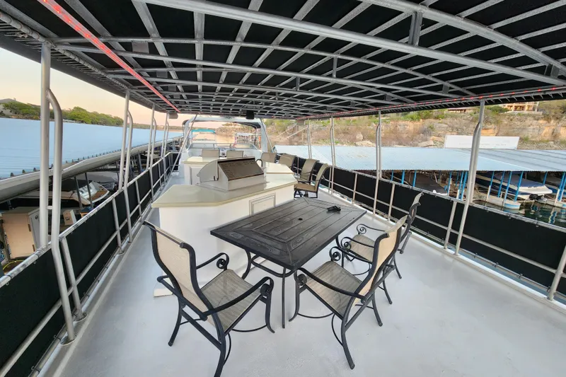 Slide: The Image of Upper deck of 2000 Sharpe 85 houseboat with seating and grill area. - 43