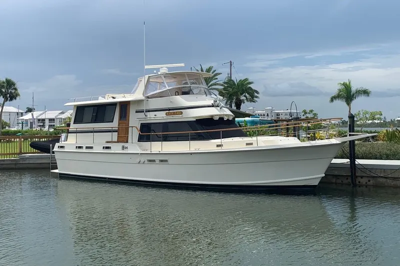 The Image of 1985 Gulfstar MK2 yacht docked in harbor, surrounded by palm trees. - 0