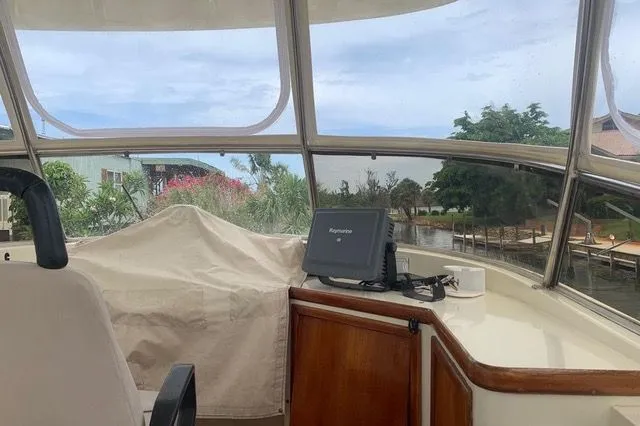 Slide: The Image of Interior view of a 1985 Gulfstar MK2 yacht with navigation system. - 13