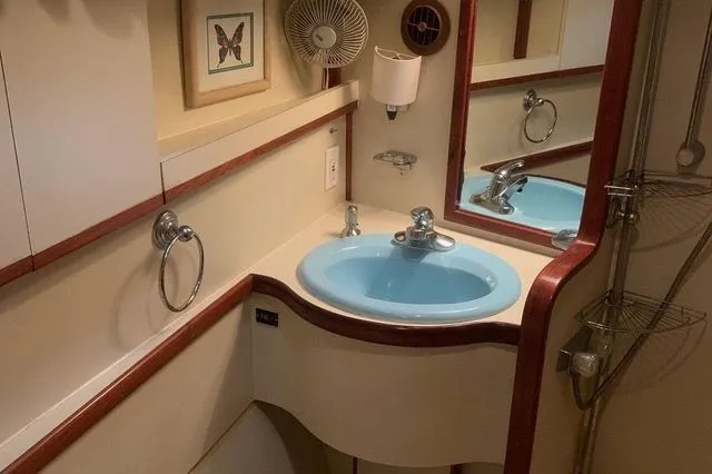 Slide: The Image of Gulfstar MK2 1985 bathroom with blue sink and mirror. - 18
