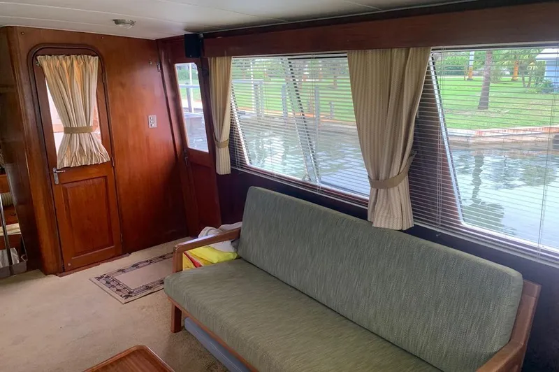 Slide: The Image of Interior of a 1985 Gulfstar MK2 yacht with sofa and windows. - 20