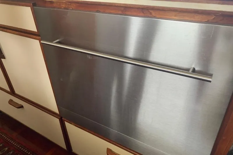 Slide: The Image of Stainless steel kitchen cabinet with wood trim, Gulfstar MK2 1985. - 32
