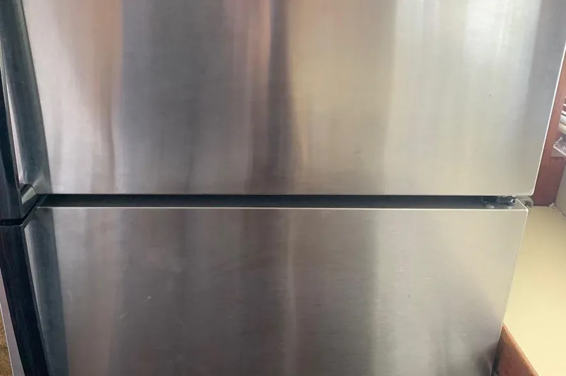 Slide: The Image of Stainless steel refrigerator with two doors, close-up view. - 33