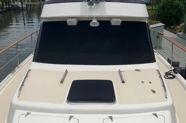 Slide: The Image of 1985 Gulfstar MK2 boat, front view at dock. - 4