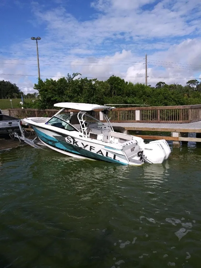 Slide: The Image of 2019 Blackfin 272 DC boat in water, featuring "Skyfall" lettering. - 27