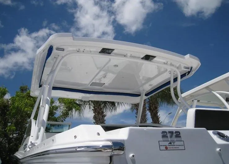 Slide: The Image of 2019 Blackfin 272 DC boat with sunshade against blue sky. - 3