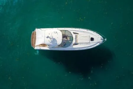 Slide: The Image of Aerial view of 2009 Sea Ray Sundancer 350 yacht on clear blue water. - 10
