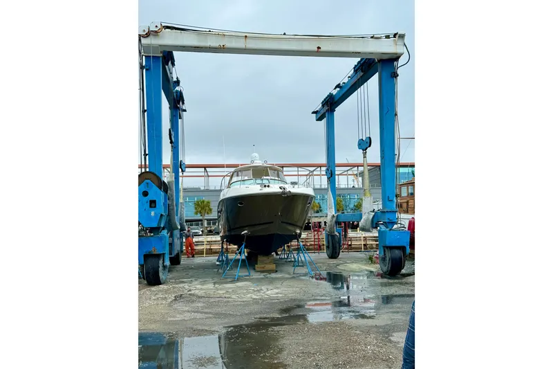Slide: The Image of 2009 Sea Ray Sundancer 350 yacht in dry dock for maintenance. - 8