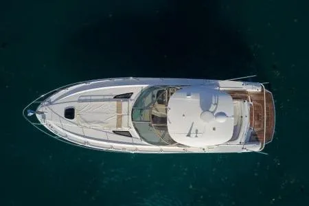 Slide: The Image of Aerial view of 2009 Sea Ray Sundancer 350 yacht on clear water. - 9