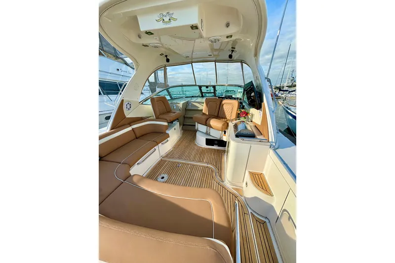 Slide: The Image of Luxurious interior of 2009 Sea Ray Sundancer 350 yacht with tan seating and wood flooring. - 11