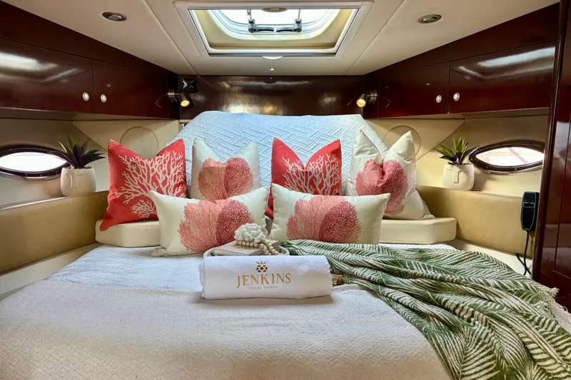 Slide: The Image of Luxurious cabin interior of 2009 Sea Ray Sundancer 350 yacht with coral-themed decor. - 17