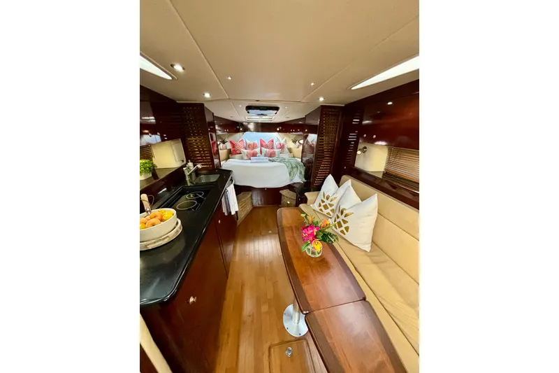 Slide: The Image of Luxurious interior of 2009 Sea Ray Sundancer 350 yacht with elegant wood finishes and cozy seating. - 14