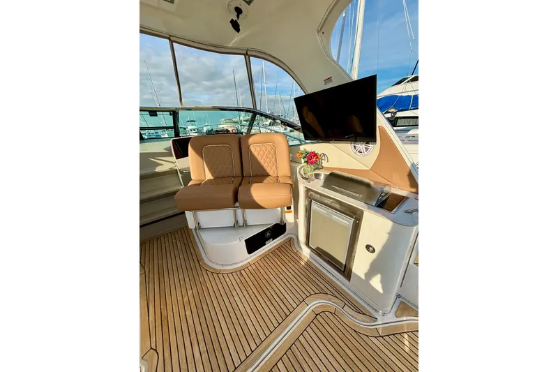 Slide: The Image of Interior of 2009 Sea Ray Sundancer 350 yacht with seating and kitchenette. - 12