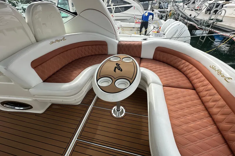 Slide: The Image of Luxurious 2004 Sea Ray 340 Sundancer boat interior with elegant seating and table. - 20