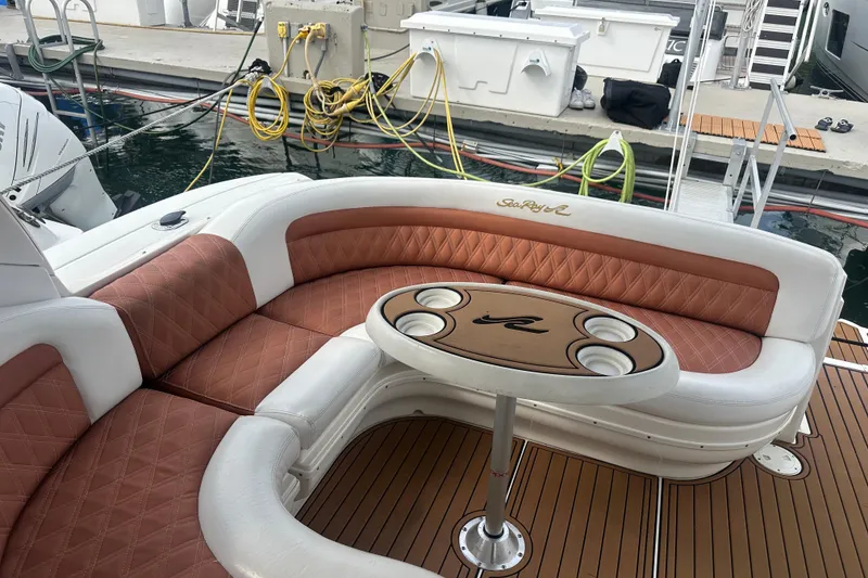 Slide: The Image of Luxurious seating area on a 2004 Sea Ray 340 Sundancer yacht at a marina. - 21