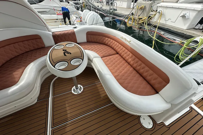 Slide: The Image of Luxurious seating area on a 2004 Sea Ray 340 Sundancer yacht at a marina. - 24
