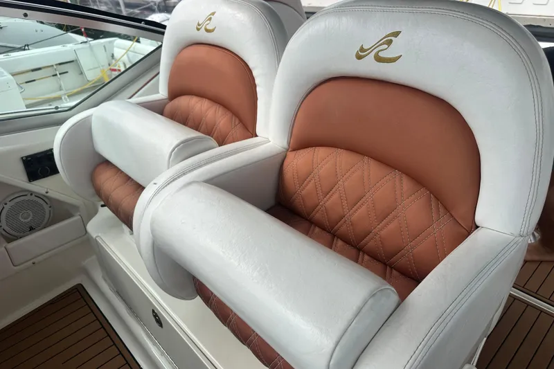 Slide: The Image of Luxurious leather seating on a 2004 Sea Ray 340 Sundancer boat, featuring elegant design and comfort. - 32