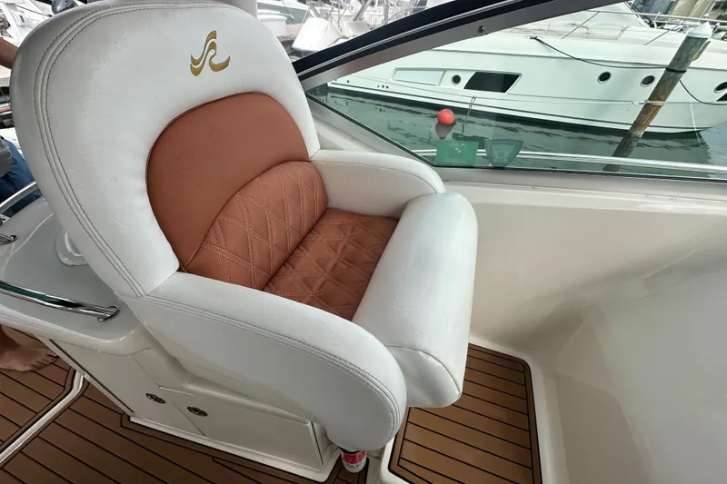 Slide: The Image of Luxurious captain's chair on 2004 Sea Ray 340 Sundancer yacht, featuring elegant design and comfort. - 33