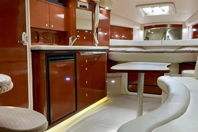 Slide: The Image of Interior of 2004 Sea Ray 340 Sundancer yacht with elegant wood cabinetry and seating. - 37
