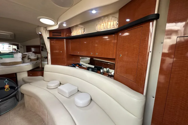 Slide: The Image of Interior of 2004 Sea Ray 340 Sundancer with elegant wood cabinetry and plush seating. - 41