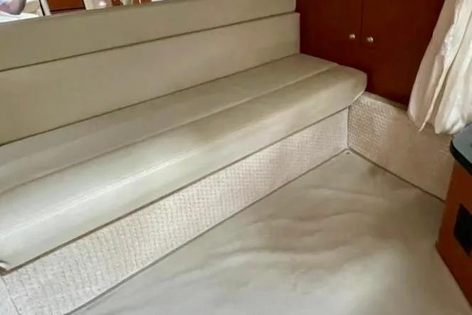 Slide: The Image of Interior seating area of a 2004 Sea Ray 340 Sundancer yacht. - 42