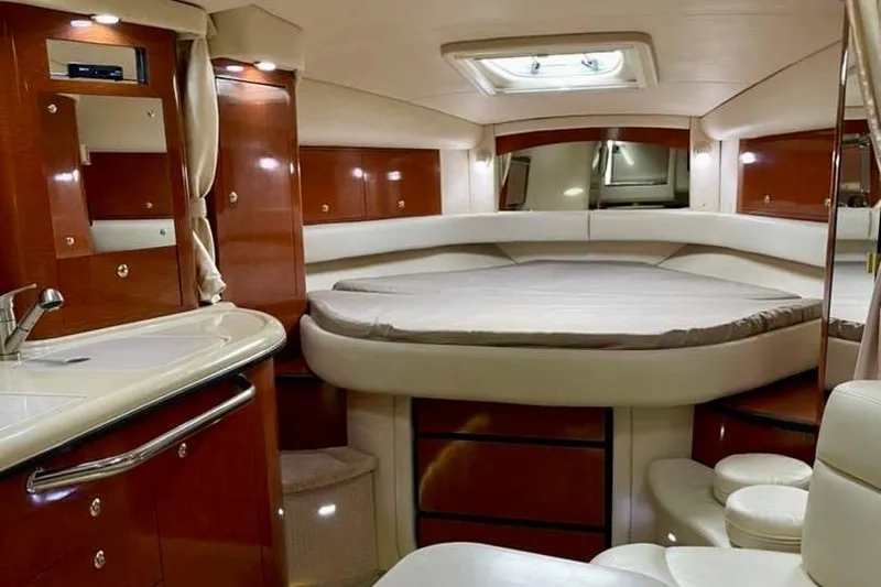 Slide: The Image of Luxurious interior of 2004 Sea Ray 340 Sundancer yacht with elegant wood finishes. - 48