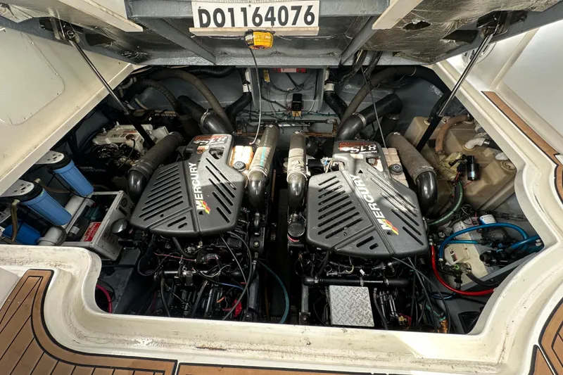 Slide: The Image of Engine compartment of a 2004 Sea Ray 340 Sundancer with twin Mercury engines. - 55