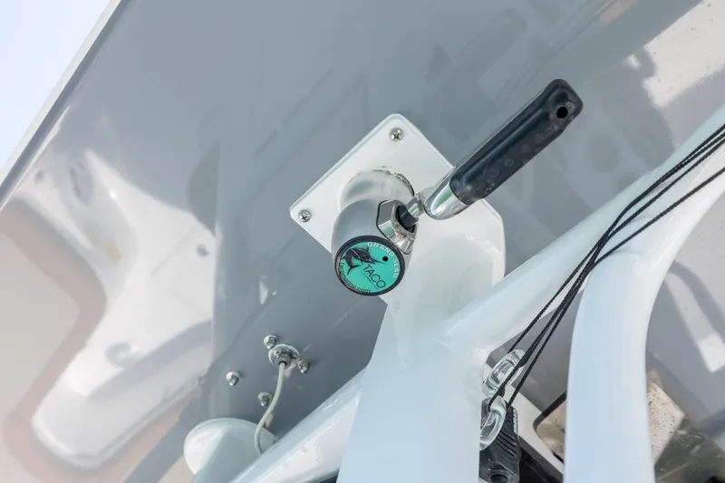 Slide: The Image of Close-up of a 2024 NauticStar 252 Legacy boat's control lever mechanism. - 25
