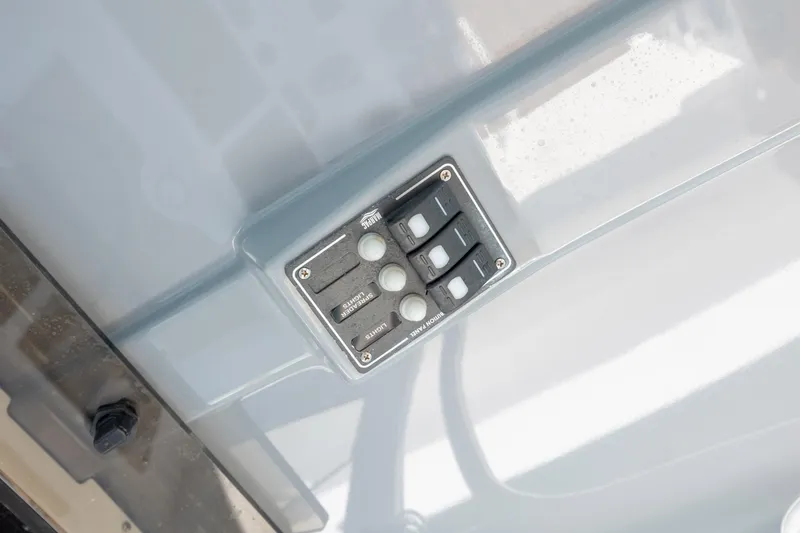 Slide: The Image of Control panel on 2024 NauticStar 252 Legacy boat dashboard. - 26