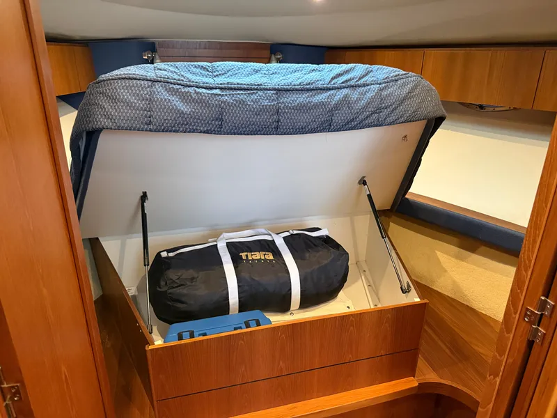 Slide: The Image of Under-bed storage in a 2013 Tiara Yachts 3600 Coronet. - 25