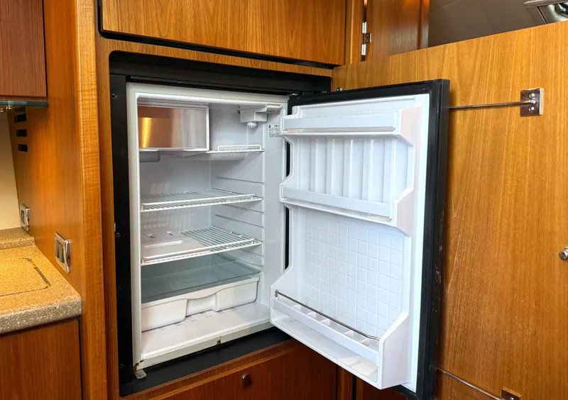 Slide: The Image of Open refrigerator in a 2013 Tiara Yachts 3600 Coronet. - 30